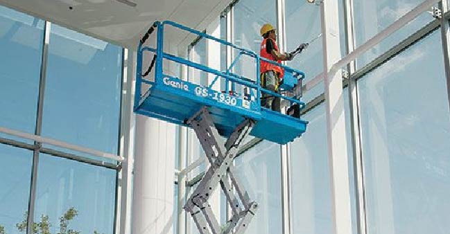 photo of a worker on a lift