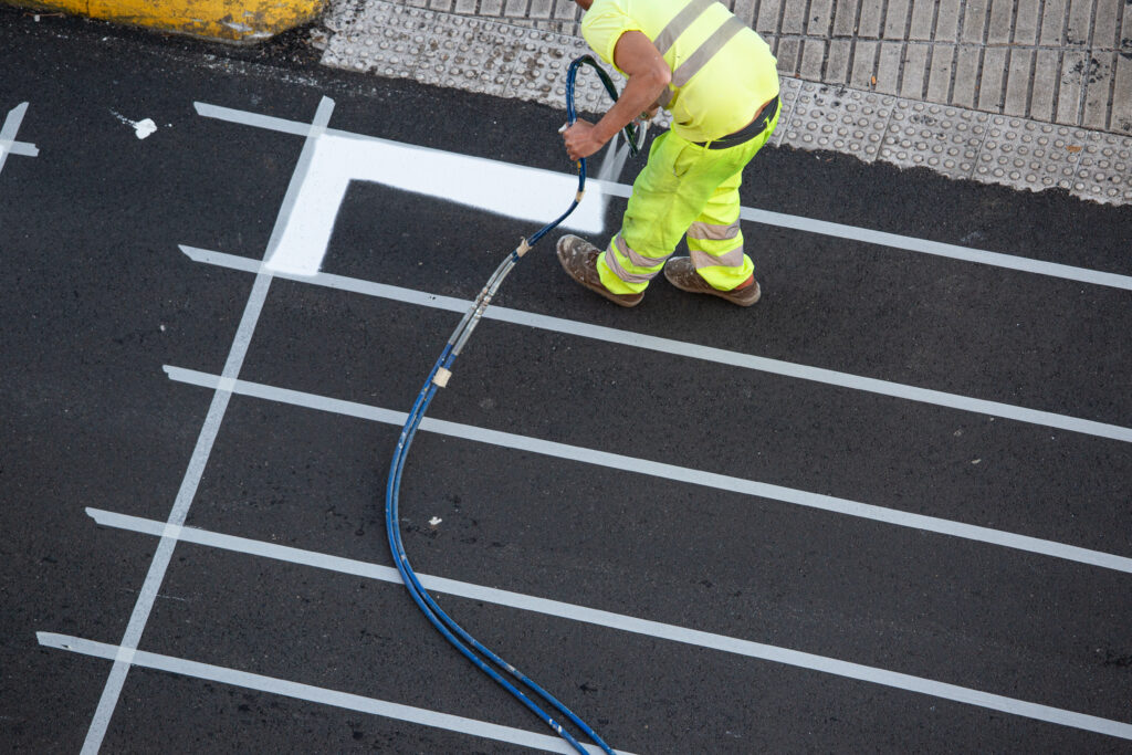worker painting a pedestrian crosswalk road 2025 02 20 23 16 40 utc