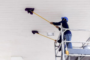 2 workers on scaffolding using flat wet mops to cl 2026 01 08 22 20 32 utc