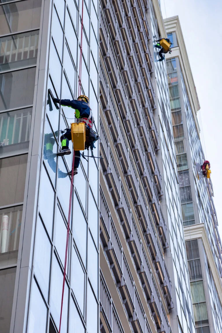 window washers cleaning the exterior of a building 2026 01 08 23 06 08 utc